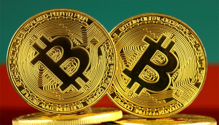 Volatile bitcoin falls from record high as crypto frenzy hits pause | Reuters