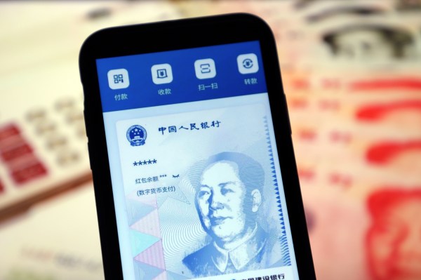 China's digital yuan transactions seeing strong momentum, says cbank gov Yi | Reuters